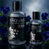 Sliquid Silver bottles surrounded by purple flowers and water droplets