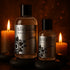 Sliquid Spark bottles beside candles in warm amber lighting