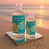 Sliquid Tsunami bottles on a mirrored platform beside the ocean at sunset