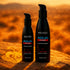 Wicked Aqua Heat warming lubricant bottles on a sunlit rock in a golden landscape