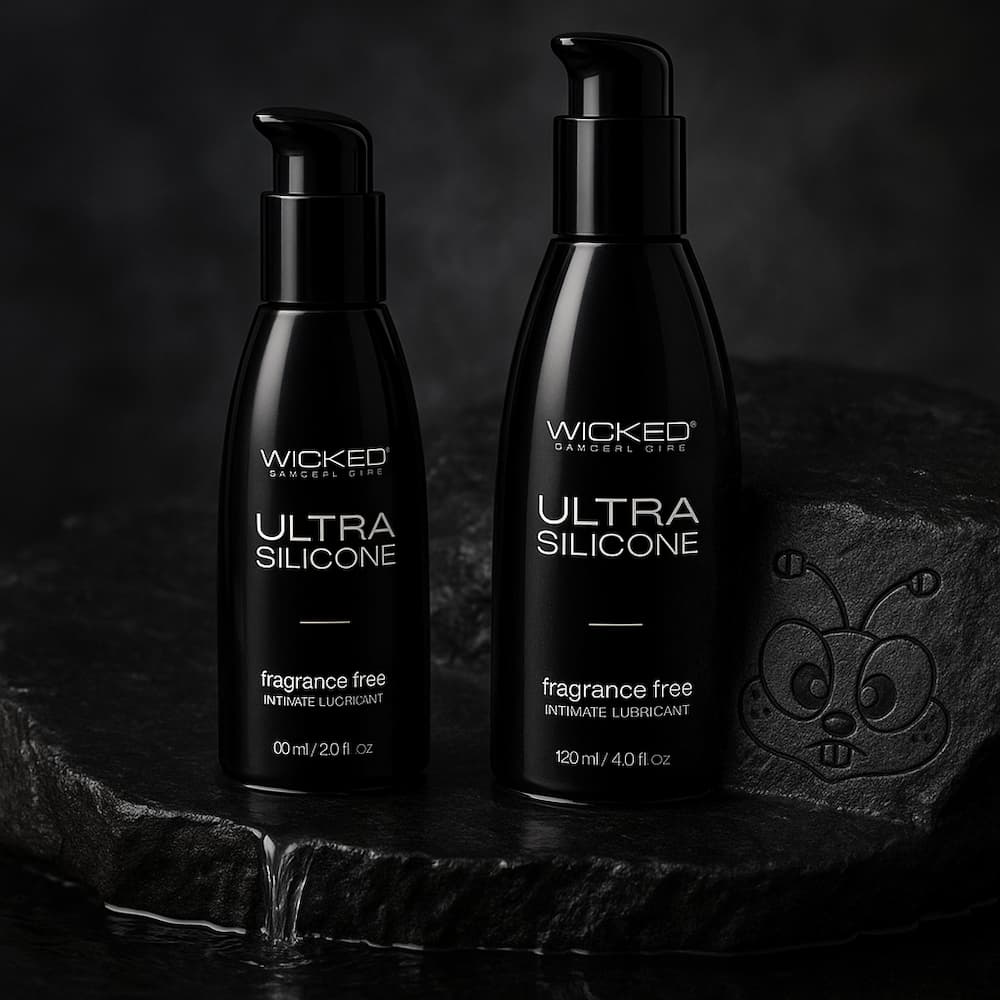 Wicked Ultra silicone lubricant bottles on a dark stone platform