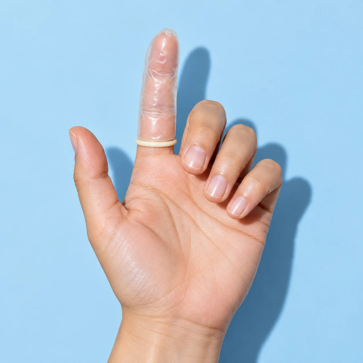 Educational illustration of a clear finger sleeve covering an adult index finger.
