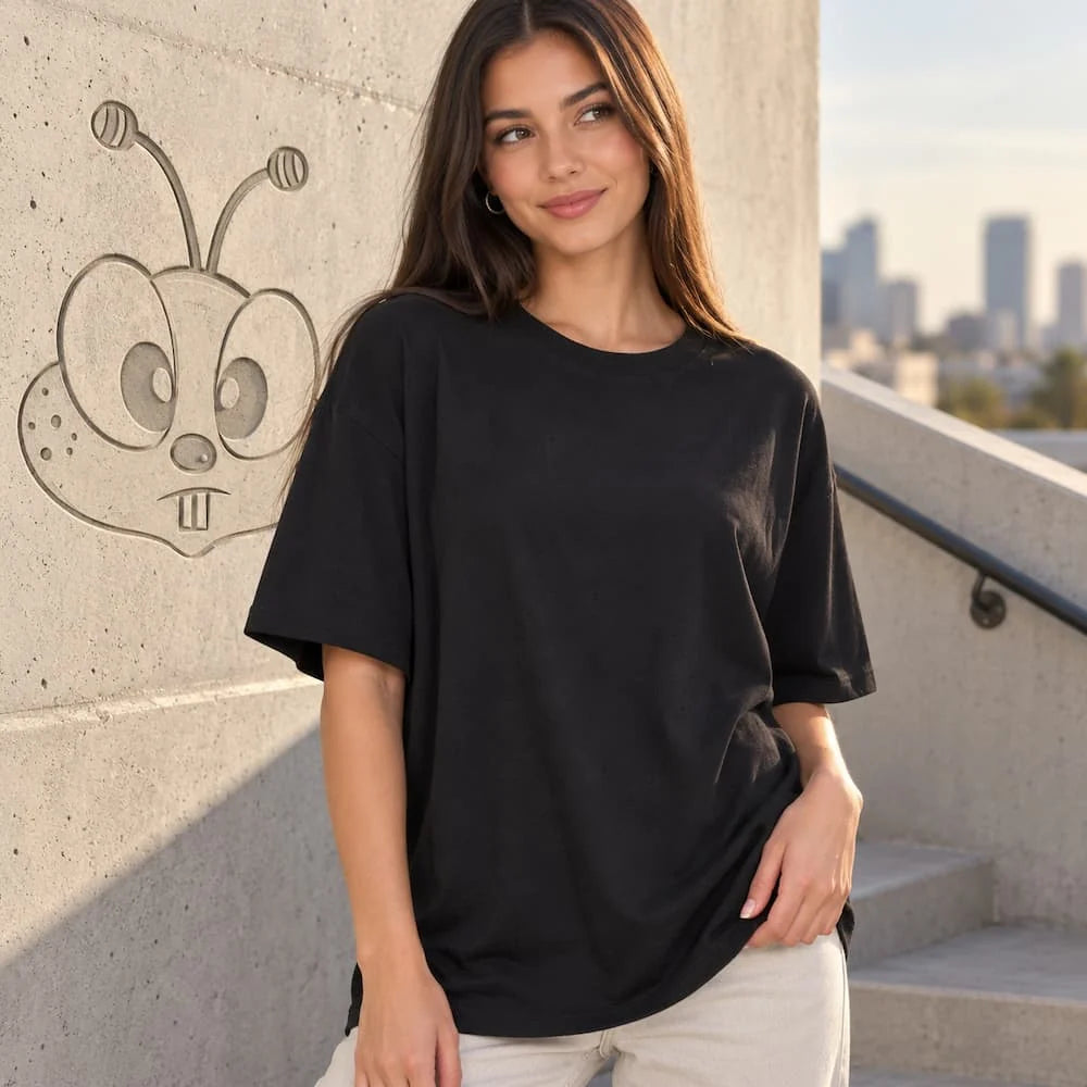 Model wearing a black oversized Zenana cotton shirt.